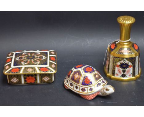 A Royal Crown Derby paperweight Imari tortoise, silver stopper; an 1128 sold gold band bell; a 1128 trinket box with cover si