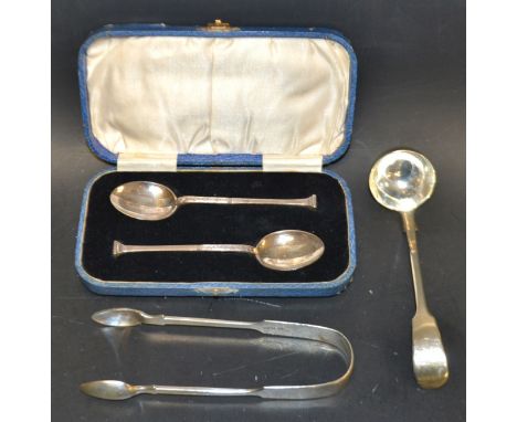 A Victorian silver saucer ladle, John & Herry Lias, London 1842;  a pair of sugar tongs, London 1869;  a case pair of Celtic 