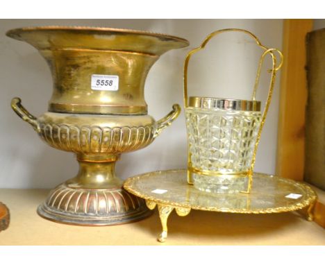 A plated twin handle urn shaped wine/ Champagne cooler; a circular tripod footed tray,central glass ice bucket with ladle (2)