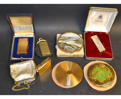  A Dunhill 70 gold plated bark effect pocket lighter, others Ronson, boxed; etc;  a Vanity fair compact;  others  (7)