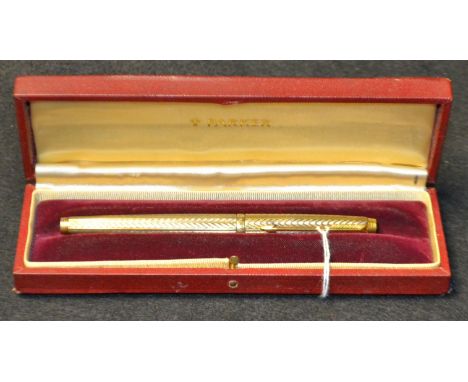 A Parker silver gilt fountain pen, with engine turned with the Fougere pattern decoration throughout, arrow clip, a compressi