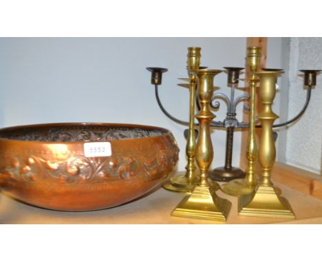 A  large Arts and Craft copper bowl, embossed with a band of scrolling foliage, 35cm diam;  brass ejector candlestick;  an Ar