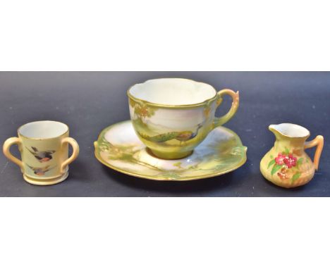 A Royal Worcester miniature loving cup, painted with birds in flight on a blush ivory ground;  a Hadley Worcester teacup and 