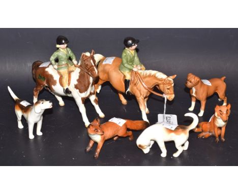 A Beswick Boy on a Palomino Pony, designed by Arthur Gredington, 14cm high, model no.1500; another, Girl on Skewbald Pony, 14
