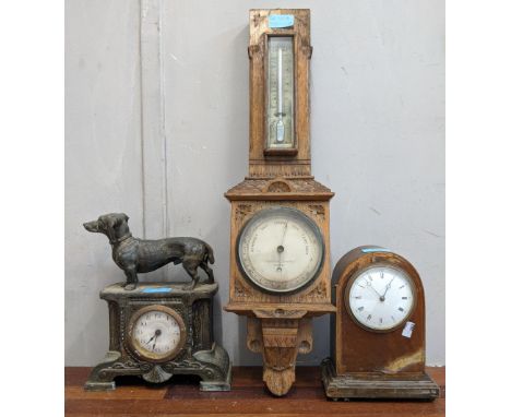 Two mantel clocks and a barometer, one clock with a composite body, Arabic dial decorated with a dachshund on the top, the ot