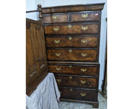 An 18th century and later walnut chest on chest, two short drawers over three graduated drawers, the base with a further thre