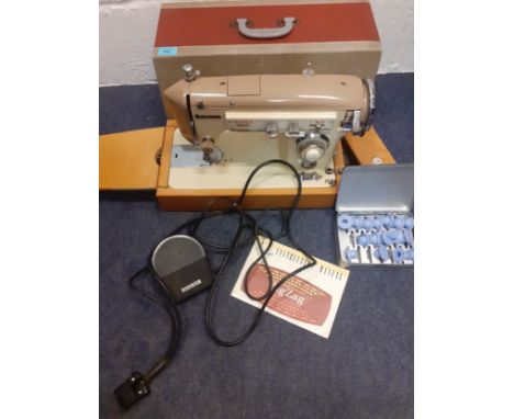 A Novum zig-zag electric sewing machine with peddle (no plug), manual and accessories. Location:If there is no condition repo