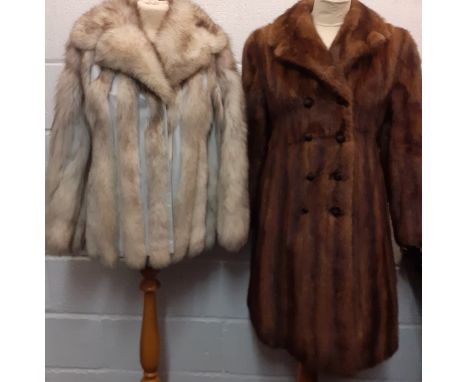 Two vintage fur coats comprising a 1970's/80's arctic fox jacket with intermittent vertical grey leather stripes approx 36" c