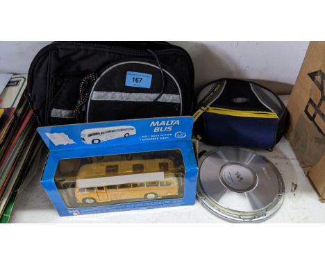 A Sony Atrac3plus MP3 CD Walkman with case, charger and travel case, together with a boxed Diecast model 'Malta Bus'Location: