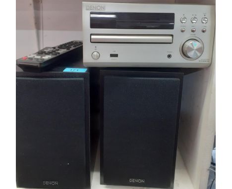 A Denon CD Receiver model no:RCD-M39DAB together with a pair of black ash speakers and remote. Location:1.4If there is no con