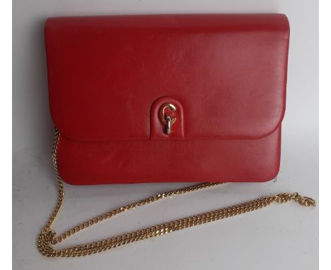 Christian Dior- A 1960's/70's red flap over shoulder bag having a gold tone shoulder chain and gold tone hardware, 19cm w x 1
