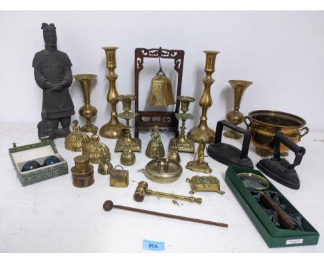 Mixed metalware to include an Asian brass temple style bell on a wooden framed stand, various lady tea bells, flat irons, pai