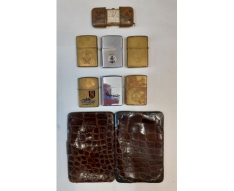 A group of lighters to include Zippo naval examples together with a pocket Laco clock with Oriental style case and an early 2