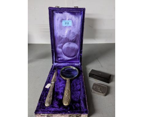 A silver plated handled magnifying lens and matching paper knife cased, and a 19th century horn snuff box with pewter inlay d