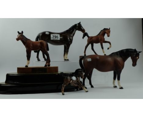 A collection of Beswick horses to include Huntsman's Horse 1484 (brown), Mare facing right head down (brown matt) 1812, Sprin