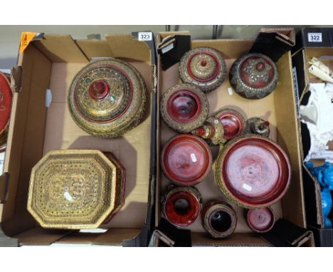 A nice collection of ruby red and gold papermache pot, boxes and vases (2 trays)