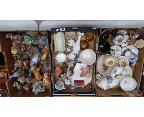 A mixed collection of items to inlcude pottery and resin figures, Poole pottery dishes, Royal Doulton vases etc (3 trays)