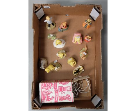 A collection of Royal Doulton figures to include Winnie the Pooh figures Pooh and Piglet Windy Day, Tiger signs the Rissoluti