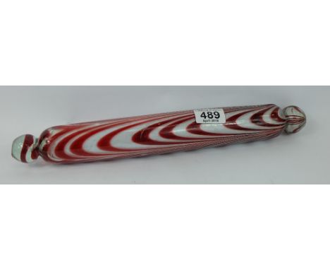 A good Victorian 'Nailsea' cranberry glass Frigger rolling pin