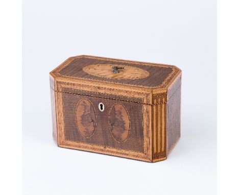 A George III inlaid tea caddy of canted rectangular shape, the hinged cover centred by a shell paterae, the sides inlaid oval