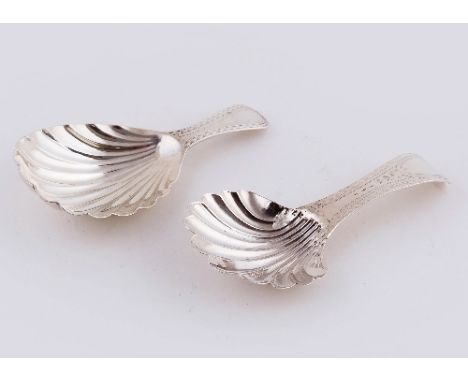 A George III silver caddy spoon, London 1781, with bright cut handle and shell bowl, initialled and another similar