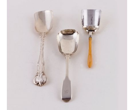 A Victorian silver caddy spoon, London 1852, of shovel form, a similar spoon and a sugar shovel