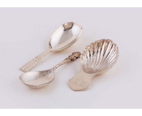A silver caddy spoon, F H, Sheffield 1963, with shell bowl, initialled, another Wakely & Wheeler, London 1951 and another Bir