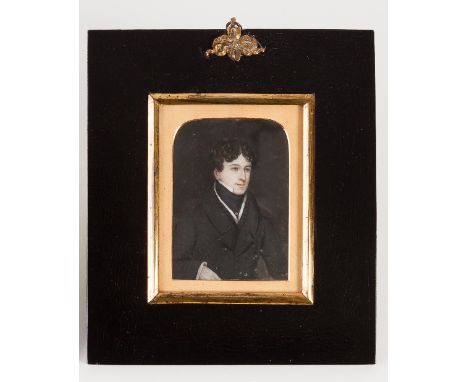 Early 19th Century English School/Portrait of a Young Man/half length, wearing a black coat/watercolour on ivory, 9cm x 6.8cm
