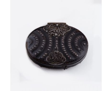An 18th Century tortoiseshell and pique snuff box, of oval form with filigree work to the hinge and clasp and bands of white 