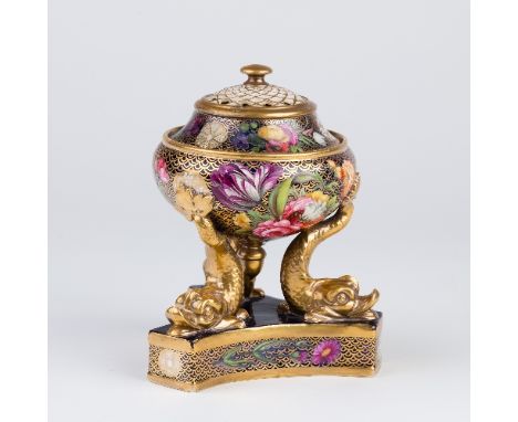 A Spode pot pourri vase and cover, with pierced cover and set on a triple dolphin support and triform base, decorated flowers