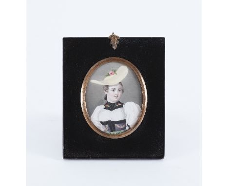 19th Century Swiss School/ Portrait of a Lady in Regional Costume/oval, watercolour on paper, 8.5cm x 7cm/in a papier mâché f
