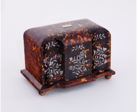 A Regency tortoiseshell rectangular shaped tea caddy, with rounded sides to the cover and twin arched front, finely inlaid fl
