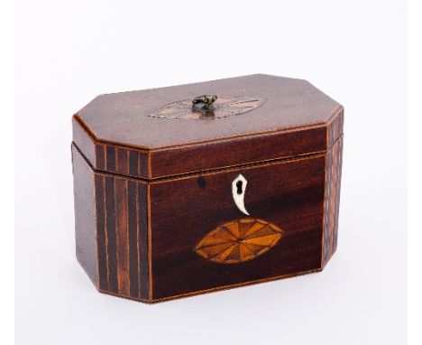 A George III mahogany rectangular tea caddy with ring handles and batswing patera to the cover, inlaid canted corners and ova