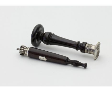 A miniature ebonised tipstaff with open crown finial and turned base, 9.5cm long and a turned wood seal with die sunk crest, 
