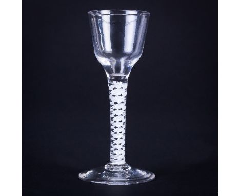 A Georgian wine glass with funnel bowl on a corkscrew airtwist stem and circular base, 14.5cm high