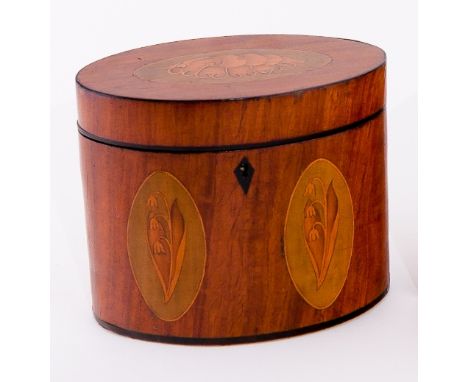 A late 18th Century satinwood oval tea caddy, the cover inlaid a shell patera and with twin lily-of-the-valley paterae to the