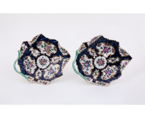 Two Worcester blue ground vine-leaf shaped dishes, painted with reserves of flowers within gilt cartouches, circa 1775, 23cm 