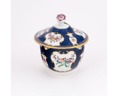 A Worcester blue scale ground sugar bowl and cover, painted with reserves of flower sprays within gilt scroll cartouches, cir