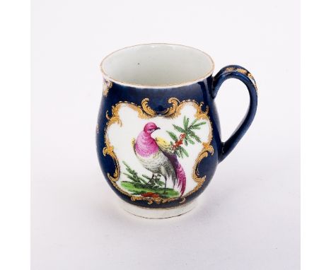 A Worcester blue scale ground bell-shaped mug, painted with two mirror-shaped cartouches each with an exotic bird, gilt scrol