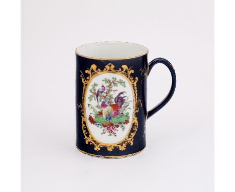 A Worcester blue ground tapering cylindrical mug, painted with opposing oval reserves of exotic birds in branches, within gil