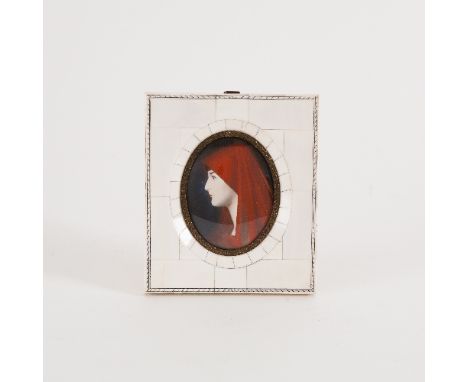 Late 19th Century French School/Portrait of a Lady in Red/oval watercolour on ivory, 8cm x 6.5cm