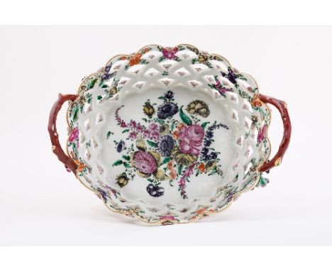 A Worcester two-handled oval basket, the interior painted with a large floral spray, the yellow ground exterior applied with 