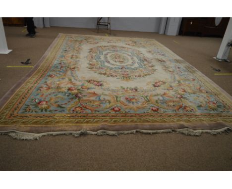 A large Chinese carpet with floral decoration. 460 x 371cms