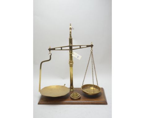 A set of 19 Century brass gate balance scales by Rogers, Newcastle, together with a set of five graduated bell weights and ot