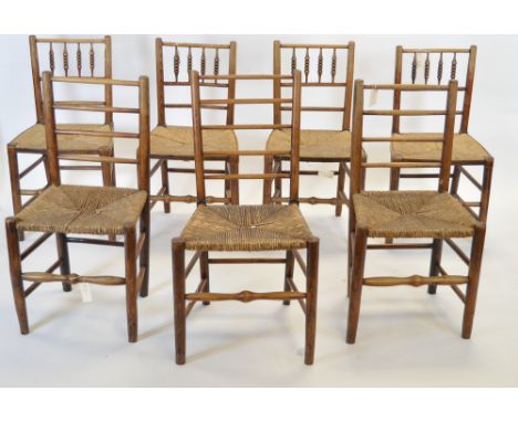 A mixed group of seven 19th century elm dining chairs, four chairs with bobbin turned backs; three chairs with ladder backs, 