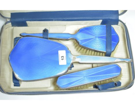Silver and blue enamel dressing set, comprising: hand mirror, hand brush and clothes brush.