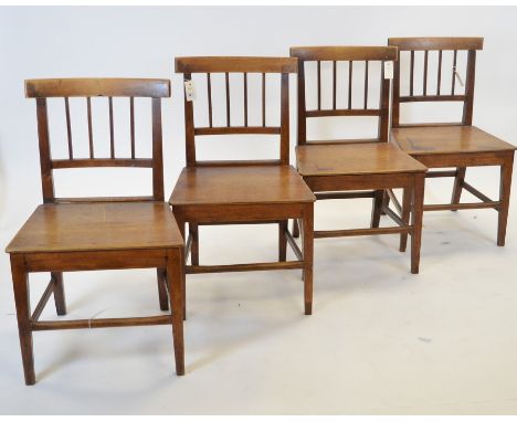 A set of four 19th Century mahogany dining chairs, with tablet top-rails and stick backs above a panelled seat and raised on 