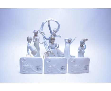 A group of seven Nao figures; together with three Lladro collectors plaques.