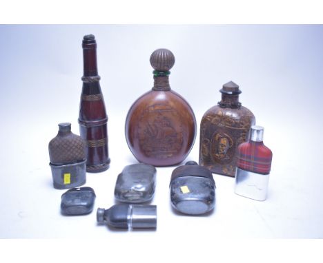 Vintage leather covered bottles and hip flasks. (9).