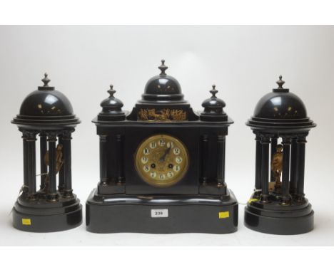 A Victorian French slate mantel clock garniture, the Arabic dial marked Reid &amp; Sons, Paris.